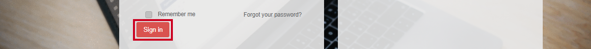 A red, rectangular Sign in button directly below the Remember me checkbox.